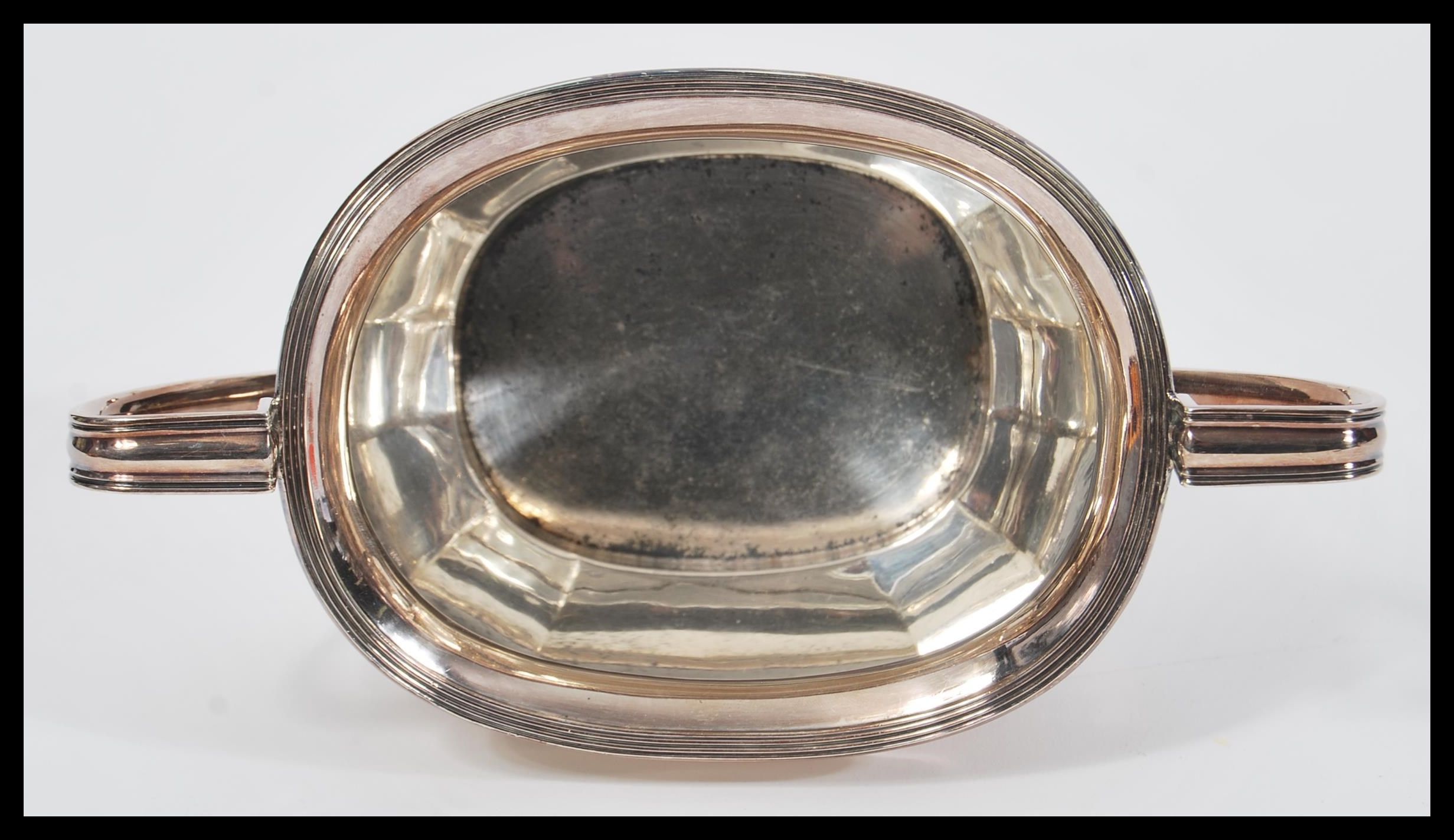 An early 20th Century hallmarked silver sugar bowl by Atkin Brothers raised on four bun feet with - Image 4 of 5