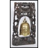 A vintage 20th Century hand carved Chinese ebonised prayer altar gong bell having dragon