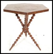 An early 20th Century Mahogany Gypsy occasional table raised on bobbin turned tripod base with