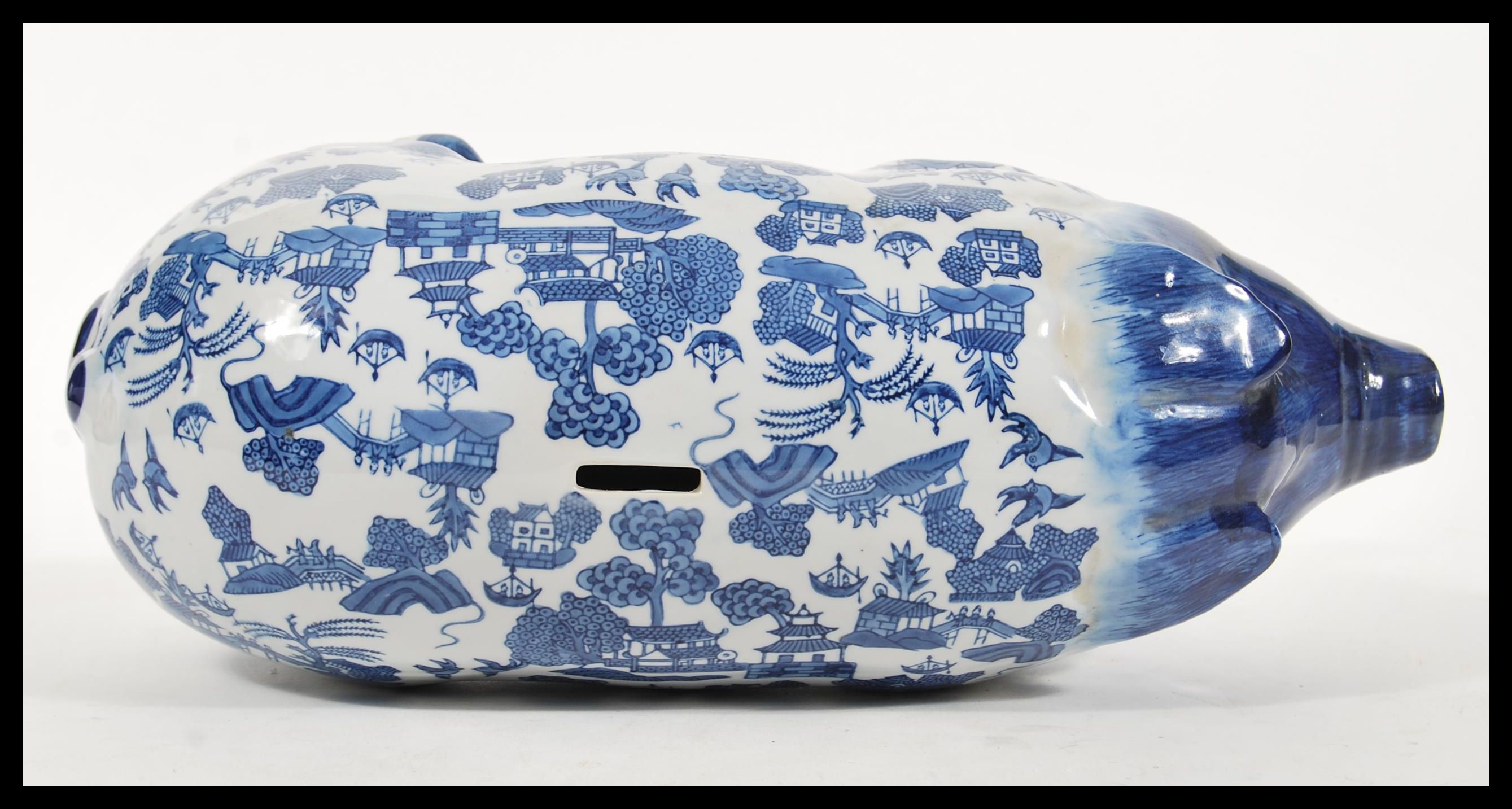 A vintage 20th Century large ceramic money bank box in the form of a pig having blue and white - Image 3 of 4