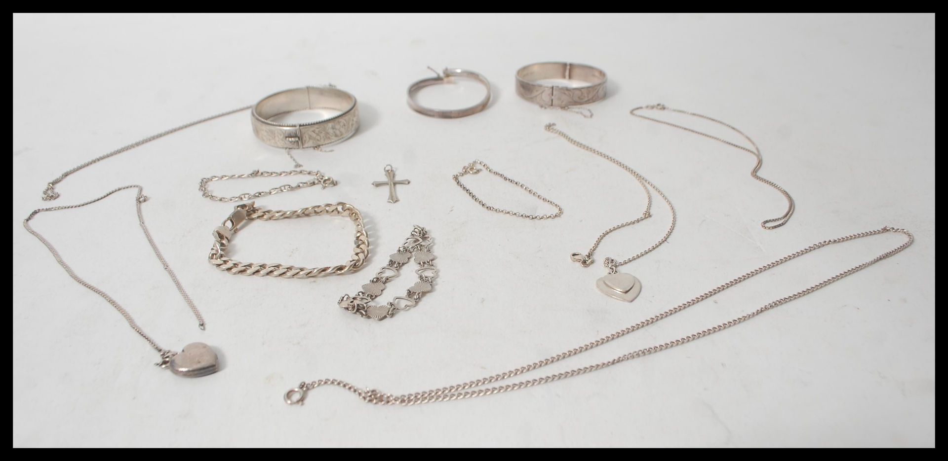A collection of silver jewellery to include various silver necklaces, silver bangles, silver - Image 2 of 14