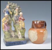 A 19th Century Staffordshire flat back figurine entitled the Traveling Musicians along with a