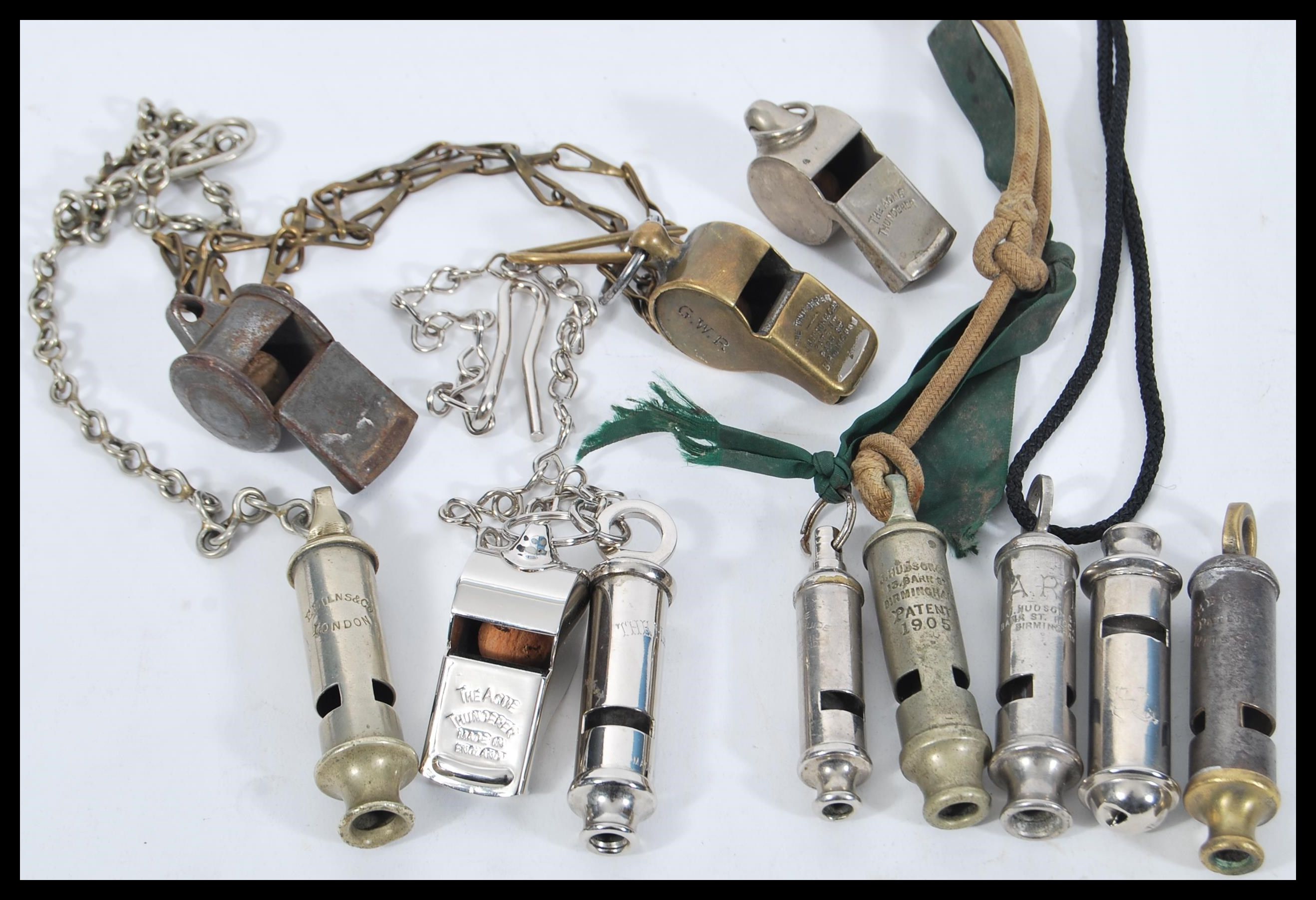 A collection of vintage early 20th Century whistles to include GWR railway, Military, Police,