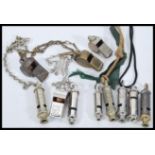 A collection of vintage early 20th Century whistles to include GWR railway, Military, Police,