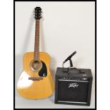 A 20th Century six string acoustic guitar by Epiphone together with an electric amp and speaker by