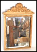 A late 19th / early 20th Century gilt pier wall mirror having bevelled glass and a moulded frame