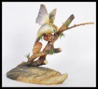 A vintage 20th Century Boehm porcelain limited edition bird figurine depicting a Marsh Tit perched