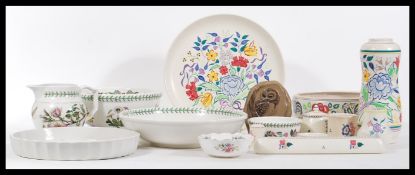 A collection of Poole Pottery and Portmeirion Botanic Garden ceramics  to include jugs, vases,