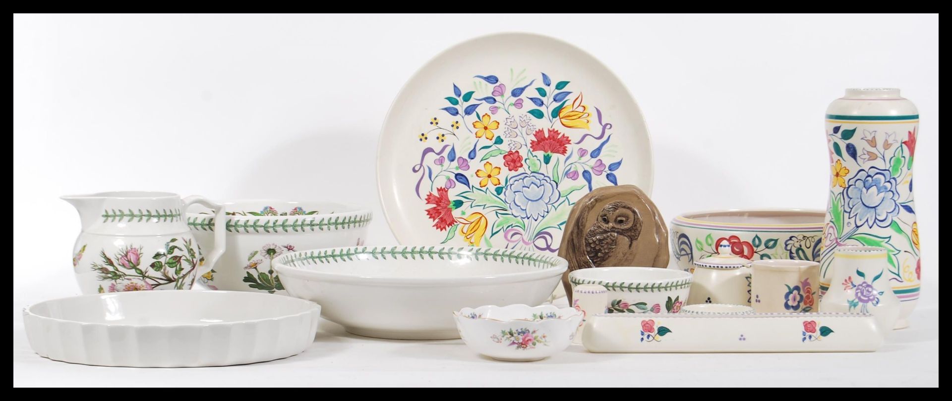 A collection of Poole Pottery and Portmeirion Botanic Garden ceramics  to include jugs, vases,