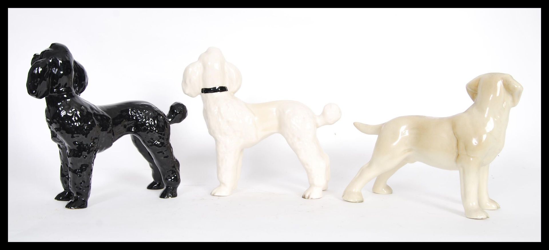 A group of three vintage 20th Century ceramic dogs to include a black and white poodle and a - Bild 2 aus 4