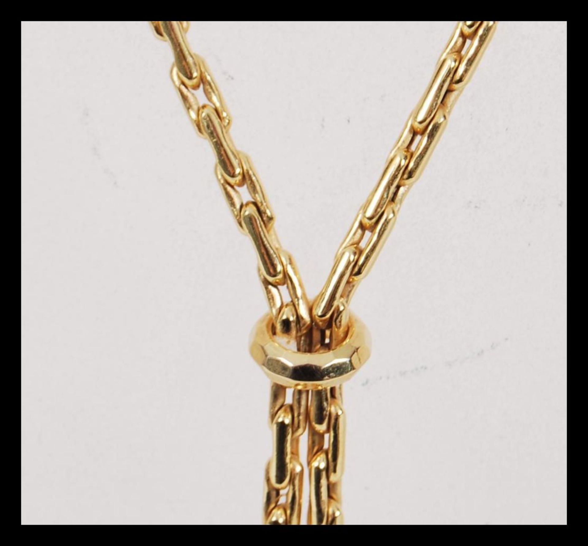 A hallmarked 9ct gold long boxlink necklace chain, having a large bolt ring clasp, with tasseled - Image 3 of 4