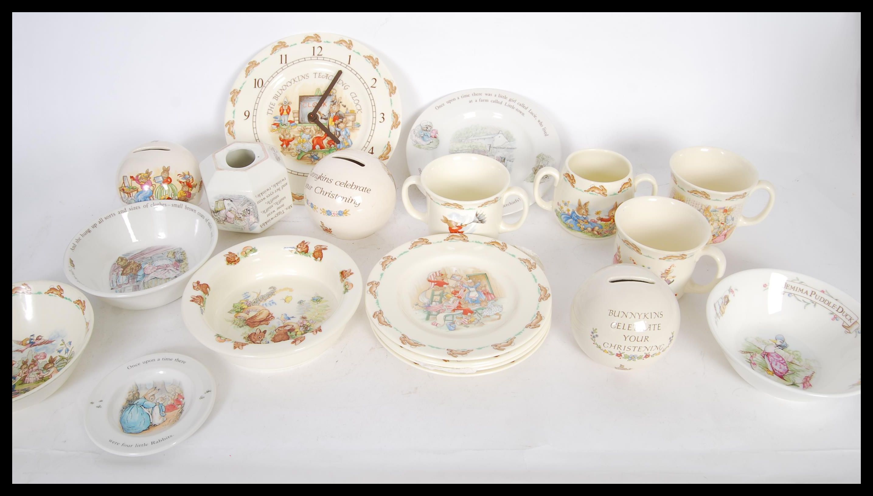 A collection of Royal Doulton ' Bunnykins ' ceramics to include small plates, mugs, money boxes, a