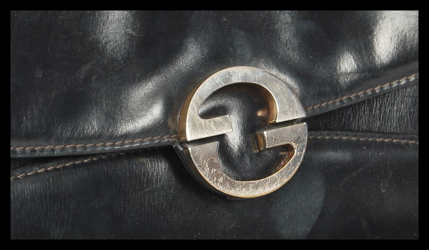 A 20th Century original designer Gucci black leather handbag with gilt metal interlocking G clasps - Image 2 of 6