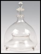 A 19th Century Victorian glass wasp catcher, of bottle form with open base and stopper to the top.