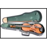 A vintage 20th Century 3/4 size violin musical instrument contained within fitted case with bow.