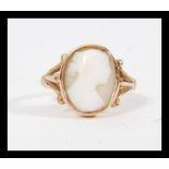 An early 20th Century hallmarked 9ct gold cameo ring having a central hand carved shell cameo