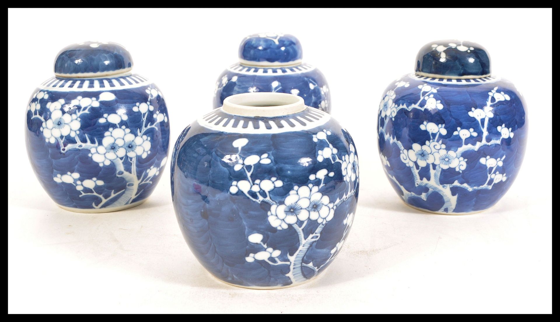Two early 20th Century Chinese blue and white ginger jars in the Prunus pattern both having double