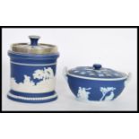 A 19th century Wedgwood blue jasperware cameo pot pourri bowl and lid with twin handles. Together