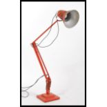 A 1940's Industrial pre-war Herbert Terry anglepoise lamp, raised on a cast metal two step base with