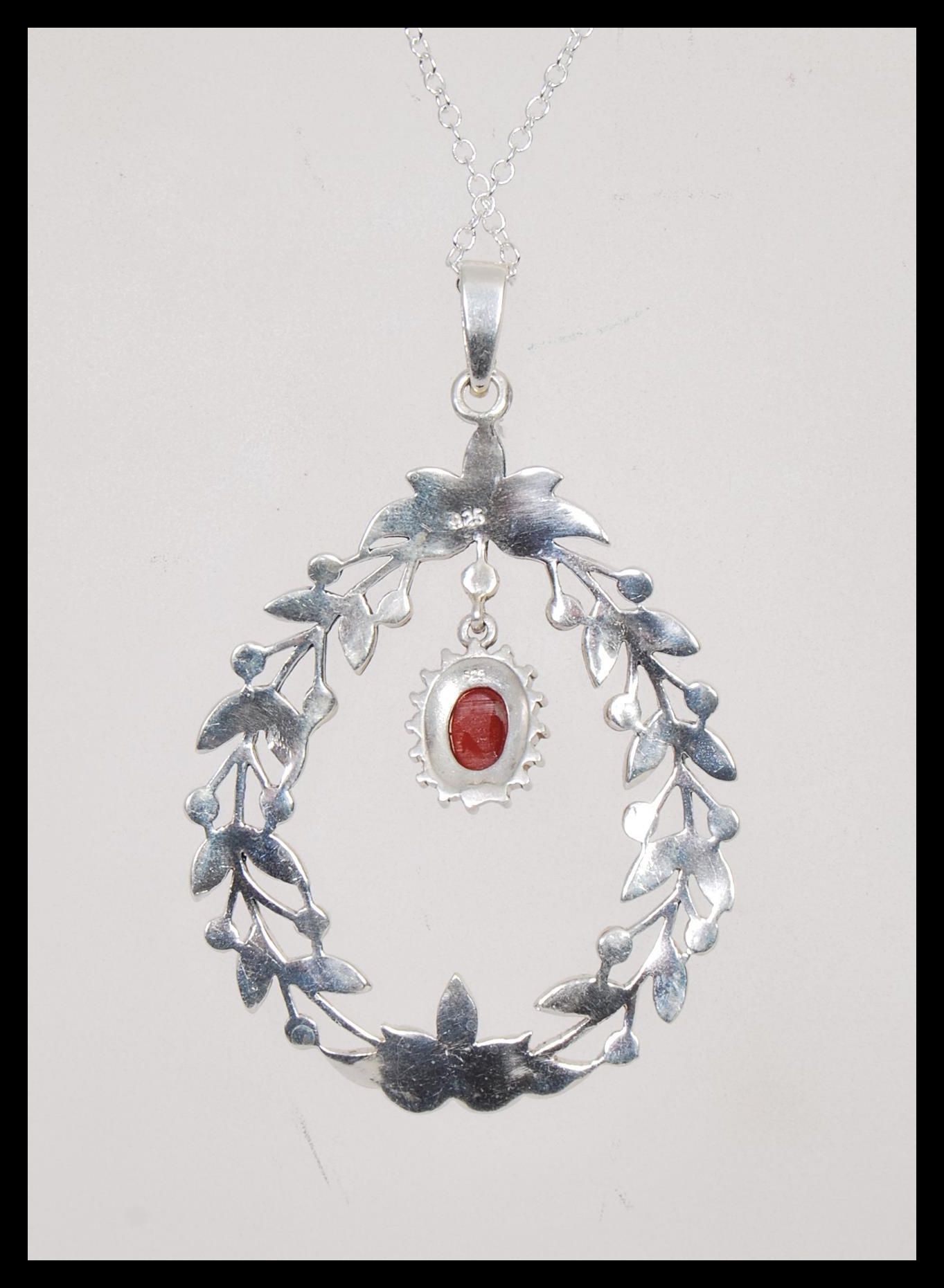 A stamped 925 silver necklace having a floral garland pendant set with marcasites and a coral - Image 3 of 4