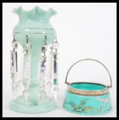 A 19th Century Victorian teal glass lustre table centerpiece having faceted glass droplets along