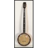 A vintage early 20th century five string banjo, with mother-of-pearl inlaid fretboard and maple