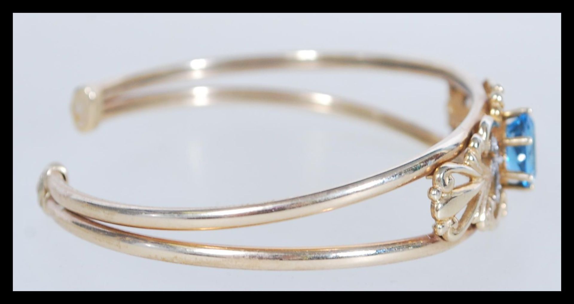 A hallmarked 9ct gold topaz and diamond cuff bangl - Image 2 of 3