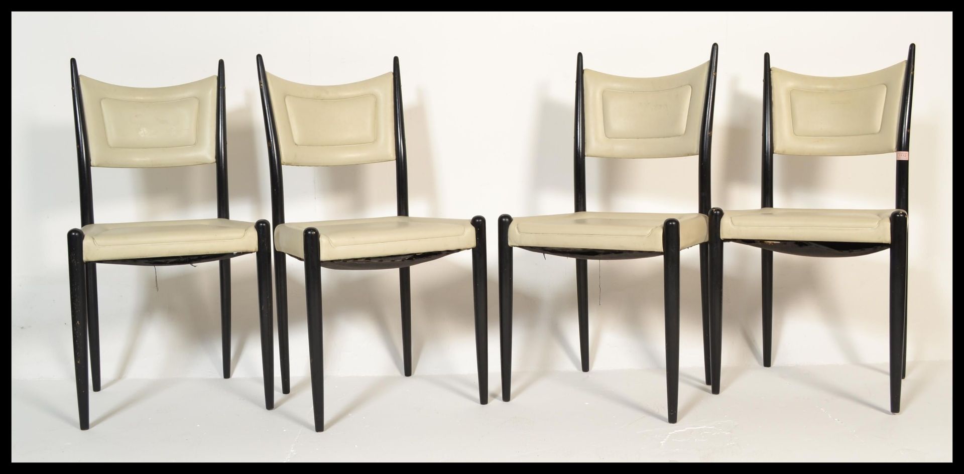 A set of four vintage 20th Century retro Ernest Gomme G-Plan / G Plan dining chairs raised on