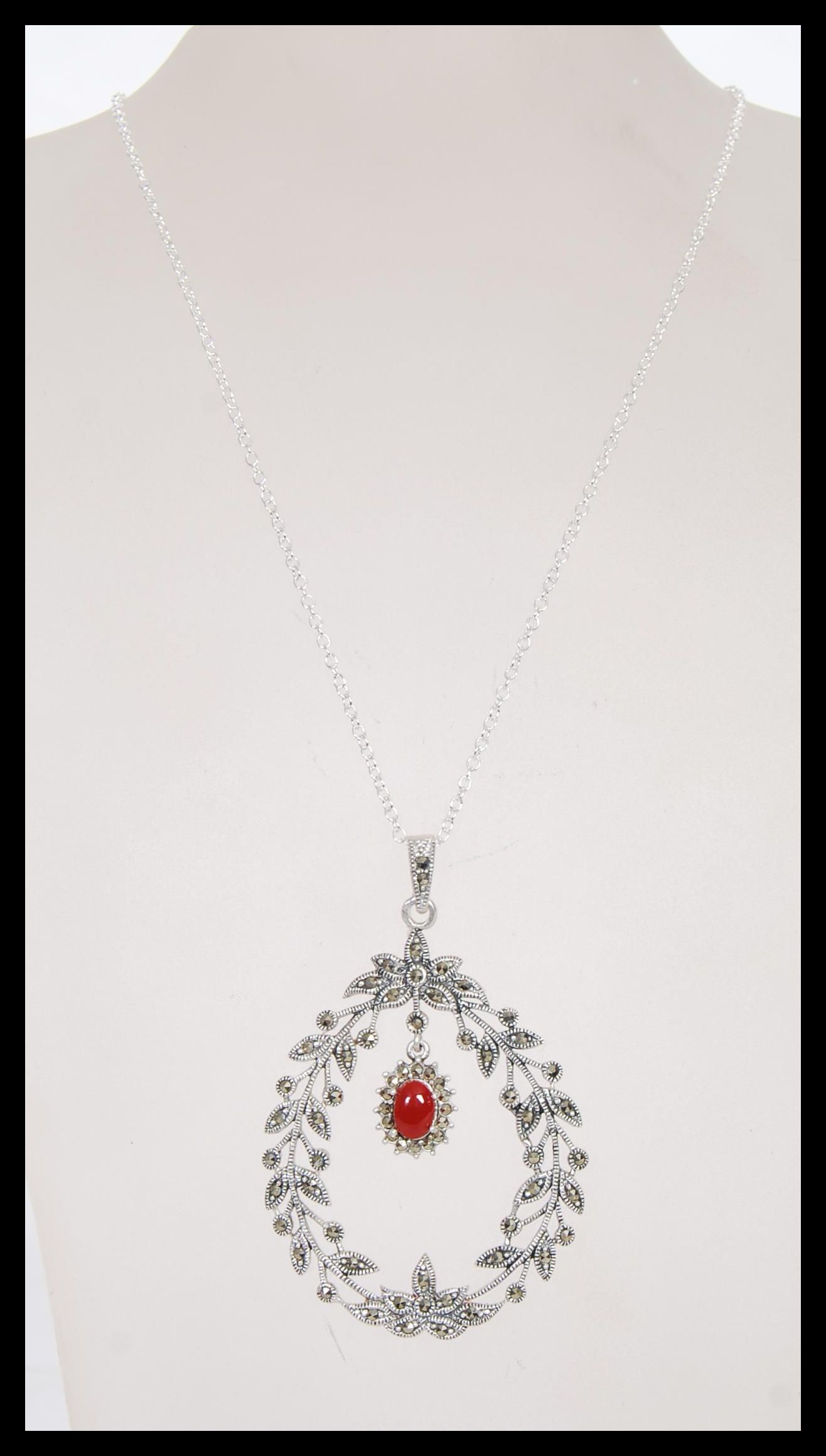 A stamped 925 silver necklace having a floral garland pendant set with marcasites and a coral - Image 2 of 4