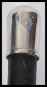 An early 20th Century Smugglers walking stick cane having a tapering ebonised shat with silver white