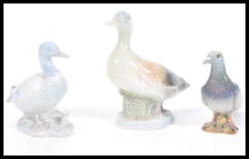 A group of 20th Century birds, to include a beswick pigeon and two ducks, one duck made by