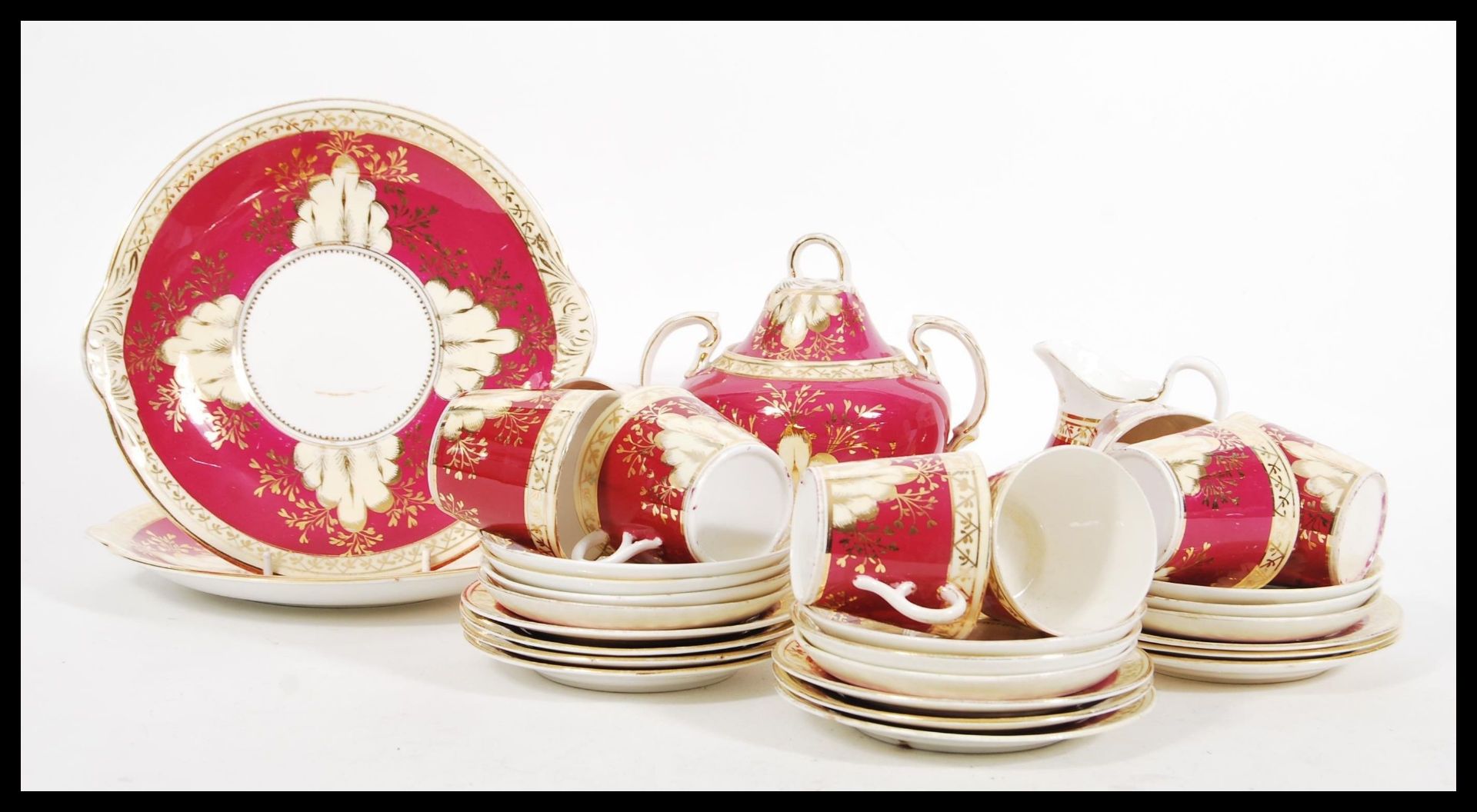 A 19th Century Victorian tea service in the manner of Worcester having ivory blush , gilded and pink