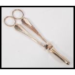 A pair of 20th Century hallmarked silver grape scissors by Frank Cobb & Co Ltd being hallmarked