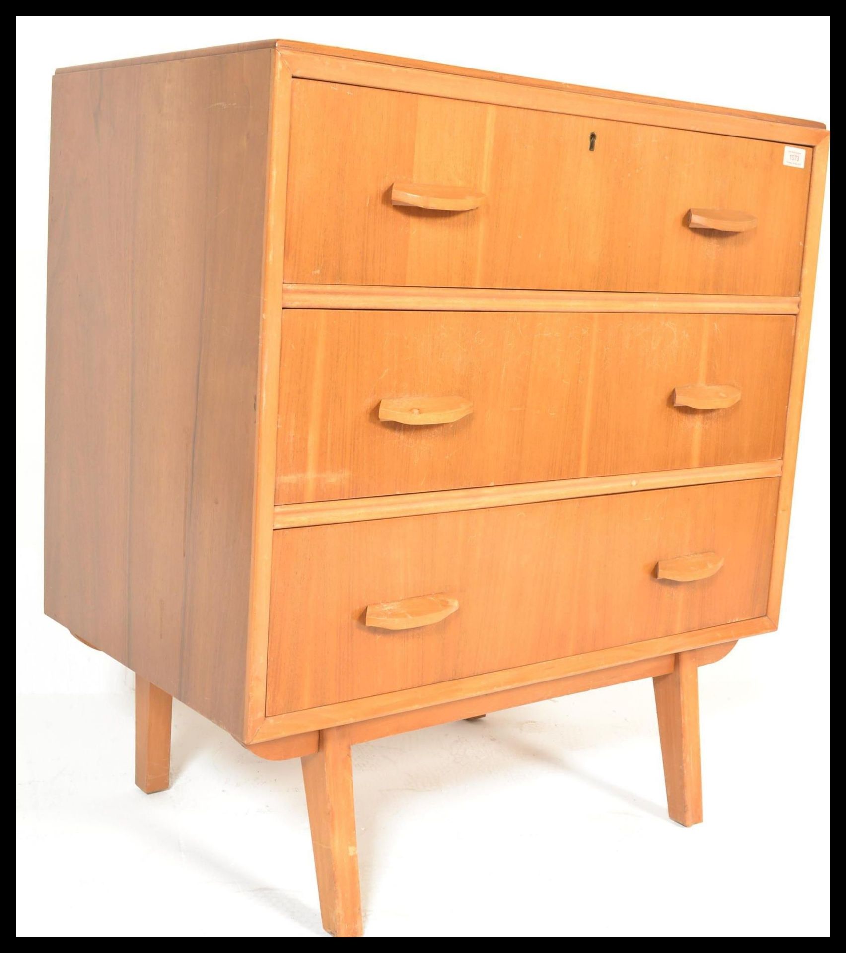 A vintage retro 20th Century Danish inspired teak wood chest of drawers, three long drawers raised