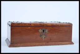 A 19th Century Victorian mahogany cigar box humidor having large armorial brass moutls with split