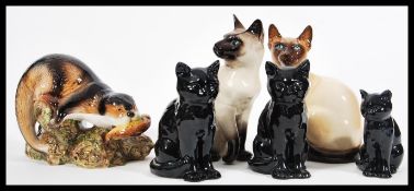 A collection of SylvaC animal figurines no include a large ceramic otter no. 3159, a Siamese cat