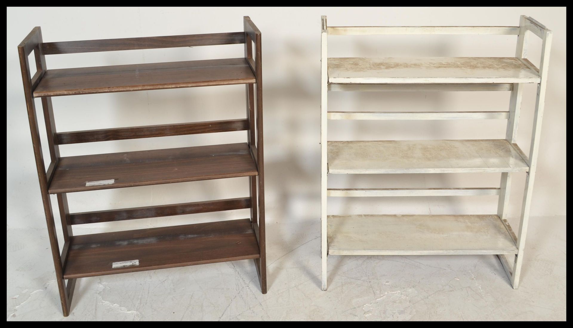 A pair of retro / vintage 20th Century folding / stacking bookcases, each with three fitted shelves.