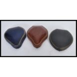 A group of three vintage leather bracelet jewellery boxes of teardrop / pear form, clasps fitted