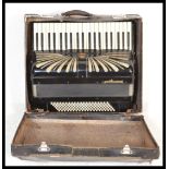 A vintage early 20th Century cased German made Regal Standard accordion