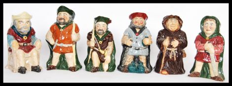 A collection of vintage 20th Century Toby Philpot and character jugs to include a set of Roy Kirkham