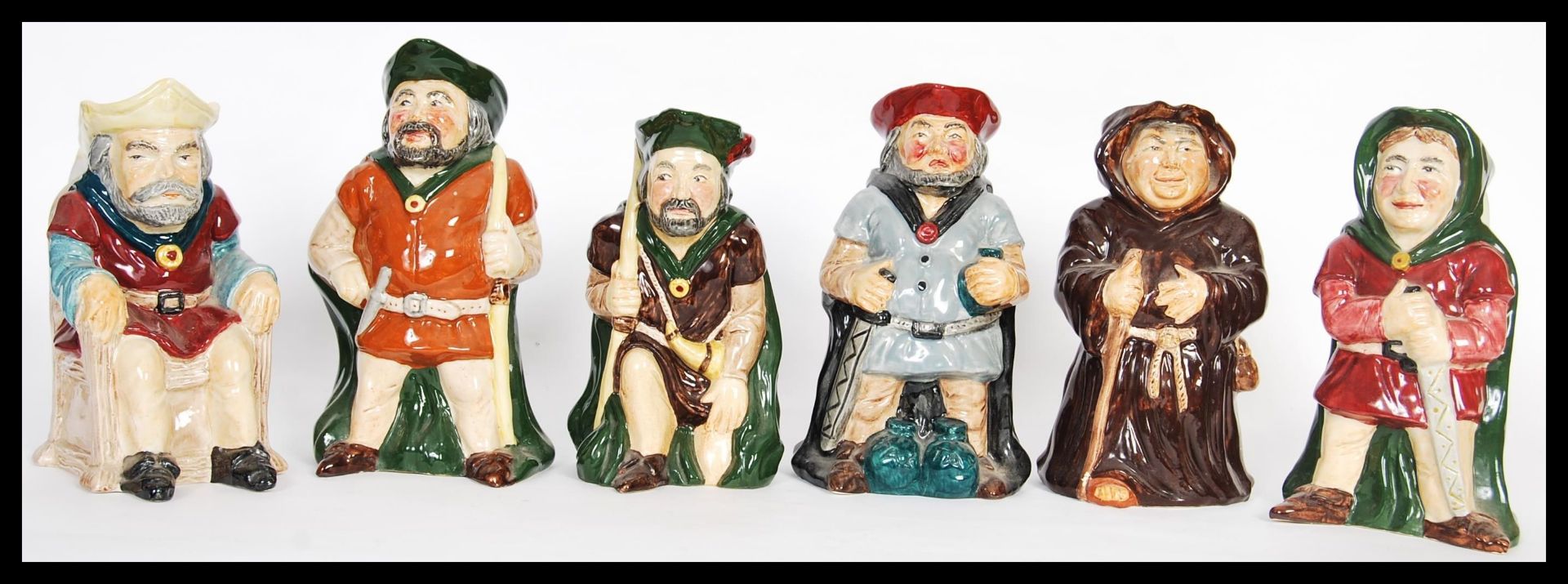 A collection of vintage 20th Century Toby Philpot and character jugs to include a set of Roy Kirkham