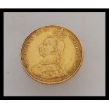 A 1987 Victorian London mint full gold sovereign having the old head of Victoria facing left. Weight