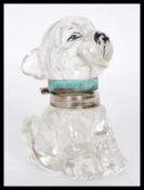 An Art Deco Czechoslovakian 1930's novelty clear glass Bonzo ink well in the form of a dog having