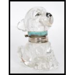 An Art Deco Czechoslovakian 1930's novelty clear glass Bonzo ink well in the form of a dog having