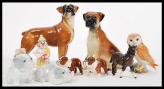 A group of Beswick and other ceramics to include pony, two boxer dogs unmarked, two pairs of