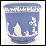 A 19th Century Adams jasperware jardiniere planter, having raised white classical scenes and borders