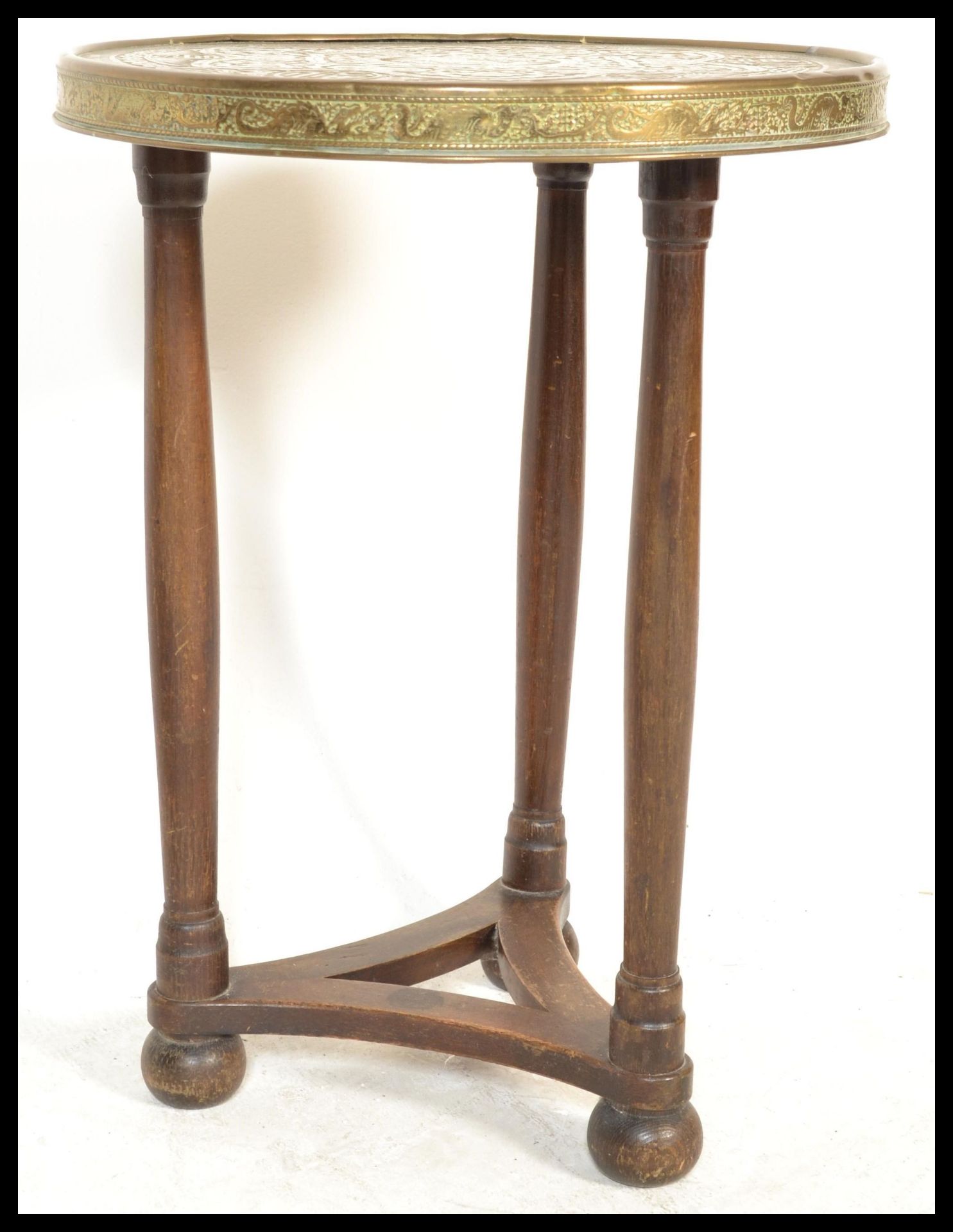 An early 20th Century Edwardian brass topped occasional side table, the brass top decorated with a