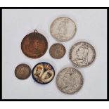 A group of Victorian coins comprising of a 1887 crown coin 2x 1889 crown, 1887 and 1902 one shilling