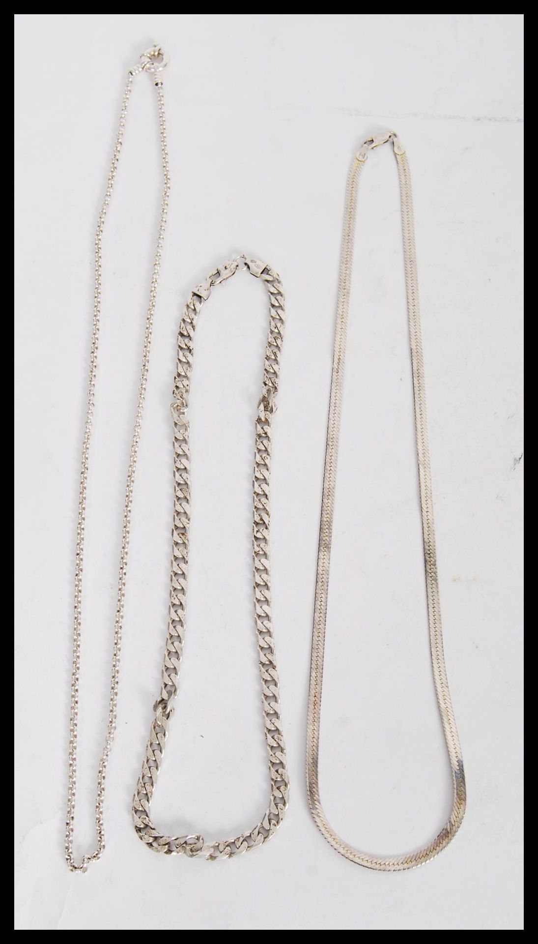 Three stamped 925 silver necklaces to include a flat linked snake chain, a flat linked necklace with - Image 2 of 5