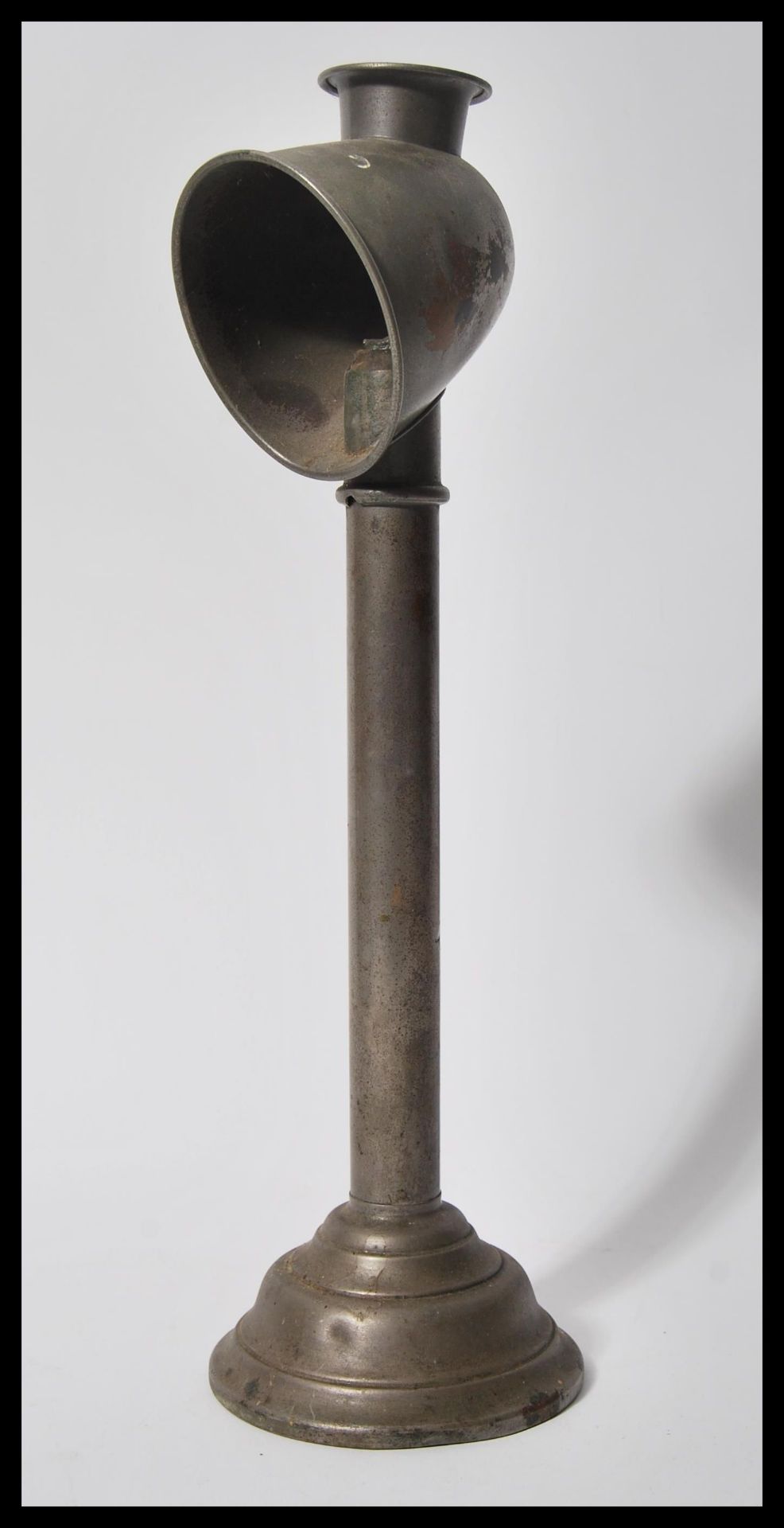 A vintage early 20th Century metal gas students lamp raised on stepped circular base with open